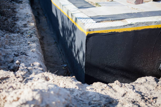 Professional Emergency Waterproofing technician working in Poland, IN